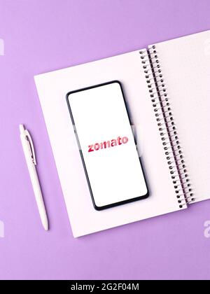 Assam, india - June 7, 2021 : Zomato logo on phone screen stock image. Stock Photo