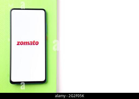 Assam, india - June 7, 2021 : Zomato logo on phone screen stock image. Stock Photo