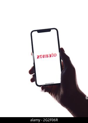 Assam, india - June 7, 2021 : Zomato logo on phone screen stock image. Stock Photo