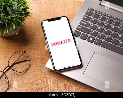 Assam, india - June 7, 2021 : Zomato logo on phone screen stock image. Stock Photo