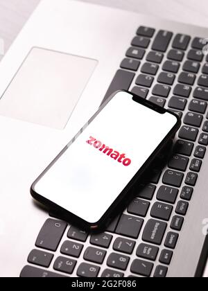 Assam, india - June 7, 2021 : Zomato logo on phone screen stock image. Stock Photo