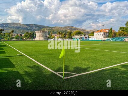 Beautiful green football field in city of Trogir in Croatia. Stock Photo