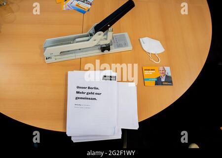 Berlin, Germany. 11th June, 2021. The draft of the government program of the CDU Berlin lies on a table during its presentation at a digital press conference. Credit: Christoph Soeder/dpa/Alamy Live News Stock Photo
