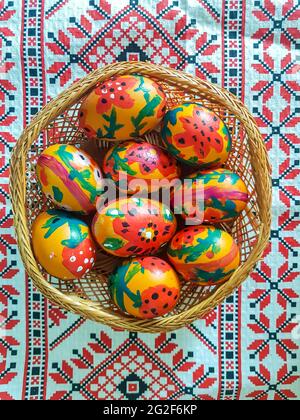 Top view of painted Easter eggs arranged in a basket Stock Photo