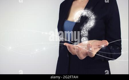 concept. Hand hold digital hologram on grey background. Stock Photo