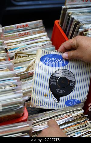 browsing through second hand vinyl records Stock Photo