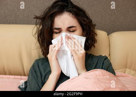 sick girl having influenza symptoms coughing at home Stock Photo