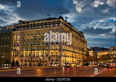 ATHENS, GREECE - Apr 20, 2021: The Grande Bretagne Hotel in the center of Athens, at night, Syntagma Square. Greece, Athens, 4-20-2021 Stock Photo