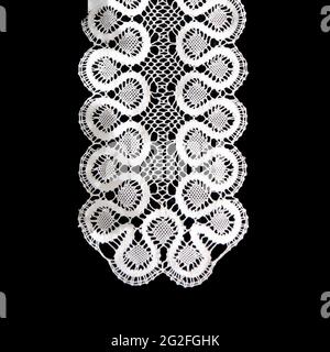 White handmade lace on black background Stock Photo