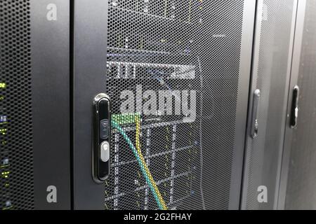 Electronic lock on server rack in data center. Server room, computer network security Stock Photo