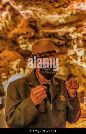 National Park Ranger leading the Natural Entrance Tour of Wind Cave, Wind Cave National Park, South Dakota, USA [No model releases; available for edit Stock Photo