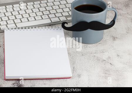 Happy Fathers Day with cup of coffee, keyboard and notepad. Stock Photo