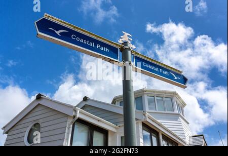 Coastal Footpath sign outside converted coastal lookout at Steephill Cove a small sandy beach on the south coast of the Isle of Wight Hampshire UK Stock Photo