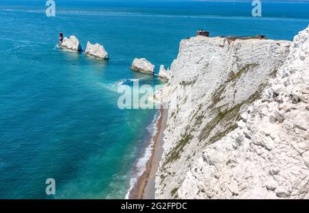 The Needles chalk stacks and Needles lighthouse guarding The Solent at the western point of the Isle of Wight UK Stock Photo