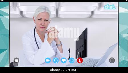 Composition of female doctor using laptop on video call interface screen Stock Photo