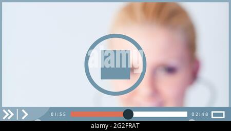 Composition of female doctor on video playback interface screen Stock Photo