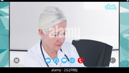 Composition of female doctor on video call interface screen Stock Photo