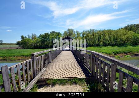 Austria, the rebuilt historical bridge of Andau over Einserkanal river - destroyed by Soviets - where the refugees from Hungary fled to Austria in 195 Stock Photo
