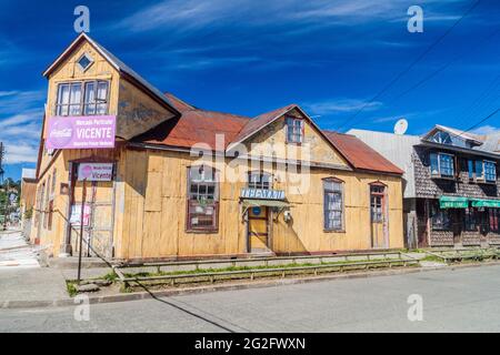 ACHAO, CHILE - MARCH 21, 2015: View of houses lining streets of Achao village, Quinchao island, Chile Stock Photo