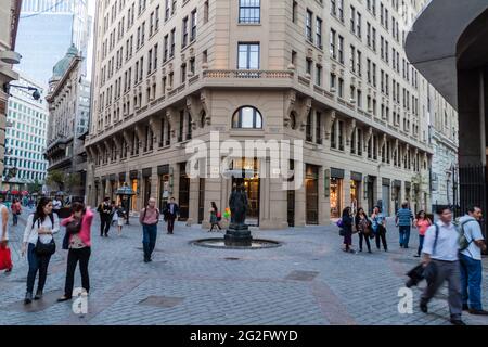 SANTIAGO, CHILE - MARCH 27, 2015: Pople walk on Nueva York street in front of Stock Exchange in Santiago, Chile Stock Photo