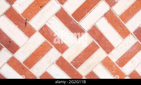 Herringbone chevron pattern Brick wall background variety of bricks brick wall made with regular new house bricks High resolution high quality photo Stock Photo