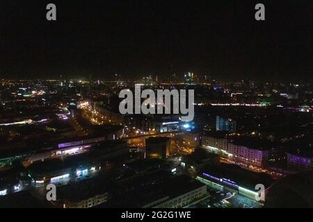 Aerial night view of Dubai Skyline under dark Sky, Dubai Downtown Residential and Business Skyscrapers, a view from Dubai Water Canal Stock Photo