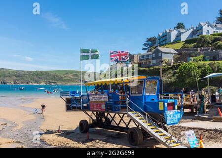 Passengers sitting on the sea tractor waiting on South Sands beach to meet the Salcombe ferry Stock Photo