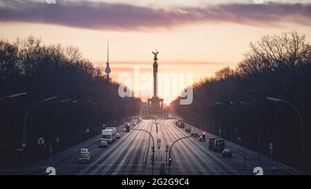 Dawn behind the Strasse des 17. Juni with the Victory Column and TV Tower in Berlin.