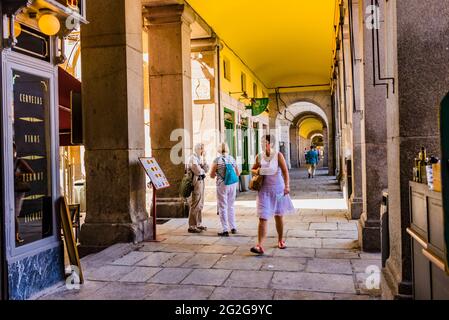 Arcades of the Main Square, Plaza Mayor, of Madrid. The Plaza Mayor is a major public space in the heart of Madrid, the capital of Spain. It was once Stock Photo