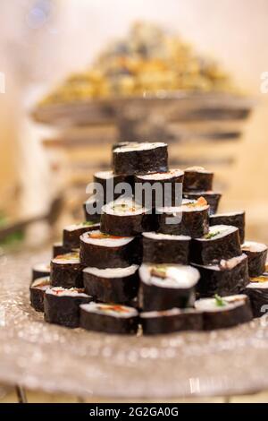 black roller rolls on a plate in a cafe Stock Photo