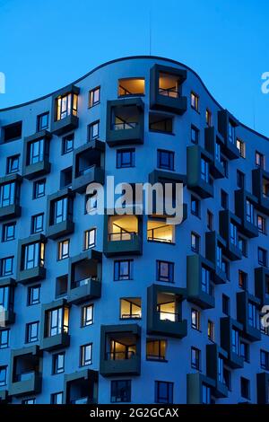 Germany, Bavaria, Munich, Munich-Sendling, high-rise residential building, block of flats, facade, in the evening, dusk Stock Photo