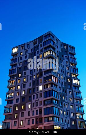 Germany, Bavaria, Munich, Munich-Sendling, high-rise apartment building, block of flats, in the evening, blue hour, dusk Stock Photo