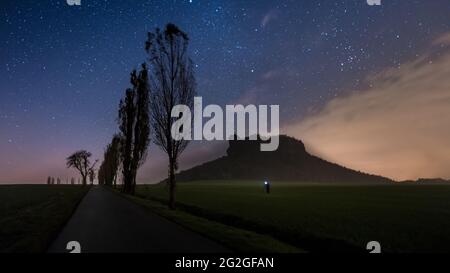 Starry sky over the Lilienstein in the Elbandsteingebirge. Stock Photo