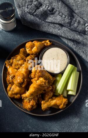 Peri Peri Chicken Wings Meal With Spicy Wedges Peas And Rice White Background Stock Photo Alamy