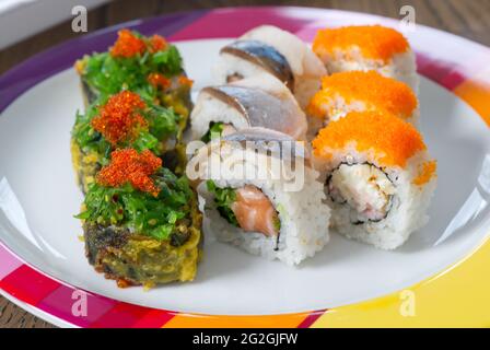 Sushi mixed set with different fish, seaweed and caviar. Restaurant home food delivery. Stock Photo