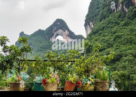The famous arched Moon Hill in the karst landscape of Yangshuo, Guilin, China Stock Photo