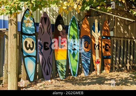 A line of colourful surf boards spelling out welcome in Toronto, Canada Stock Photo