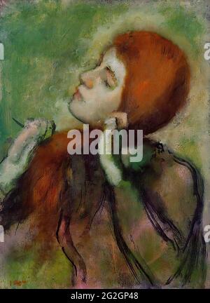 Edgar Degas -  Woman Combing Her Hair 1 C 1894 Stock Photo