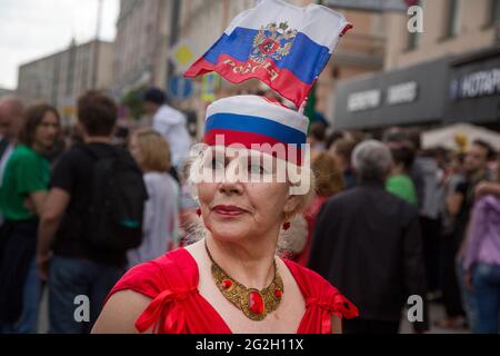 Moscow, Russia. 12th of June, 2017 A woman with a Russian tricolor during Russia Day celebration at Tverskaya Street in the center of Moscow city, Russia Stock Photo