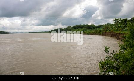 A beautiful landscape of Bangladesh. Great picture of a river. Cloudy skies in the midday sun. It is the river Gorai (Madhumati). Stock Photo