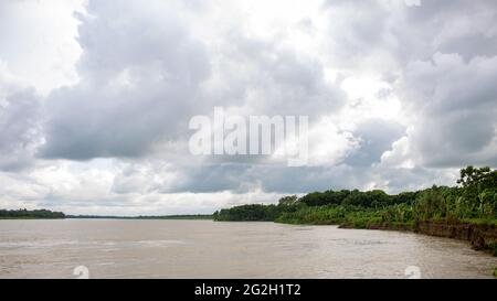 A beautiful landscape of Bangladesh. Great picture of a river. Cloudy skies in the midday sun. It is the river Gorai (Madhumati). Stock Photo