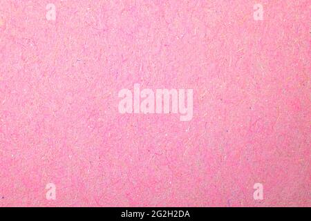 Grainy pink paper texture, paper surface background close-up Stock Photo