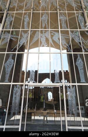 The new Cathedral in Coventry with the bombed out one reflected in the window, in Warwickshire, UK Stock Photo