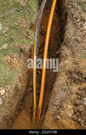 Rheinbach, North Rhine-Westphalia, Germany - Internet broadband expansion, construction site burial of fiber optic cables, new construction of fiber optic routes on behalf of Telekom, fast Internet, DSL cable connection for households. Stock Photo