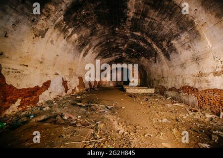 Large old historical underground red brick tunnel. Stock Photo