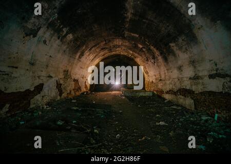 Large old historical underground red brick tunnel. Stock Photo