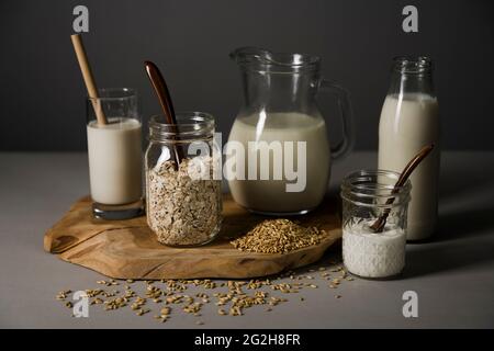 Oat milk, board, glasses, oats Stock Photo