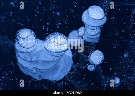 Air bubbles trapped in the ice, Nonnenmattweiher, Germany, Baden-Wuerttemberg, Southern Black Forest Stock Photo