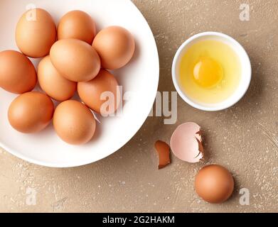 bowl of brown chicken eggs on kitchen table, top view Stock Photo