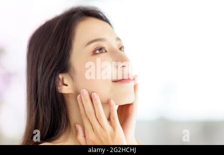 beautiful young asian woman with clean fresh healthy skin Stock Photo